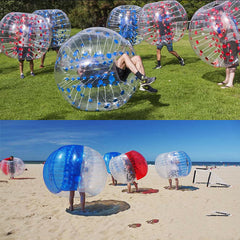 Bunte aufblasbare Bumperbälle auf Gras und Schnee